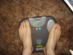 Trent's feet while weighing himself on a scale