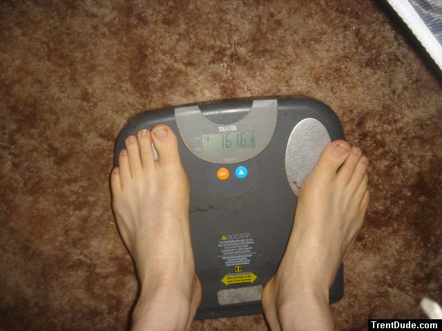 Trent's feet while weighing himself on a scale