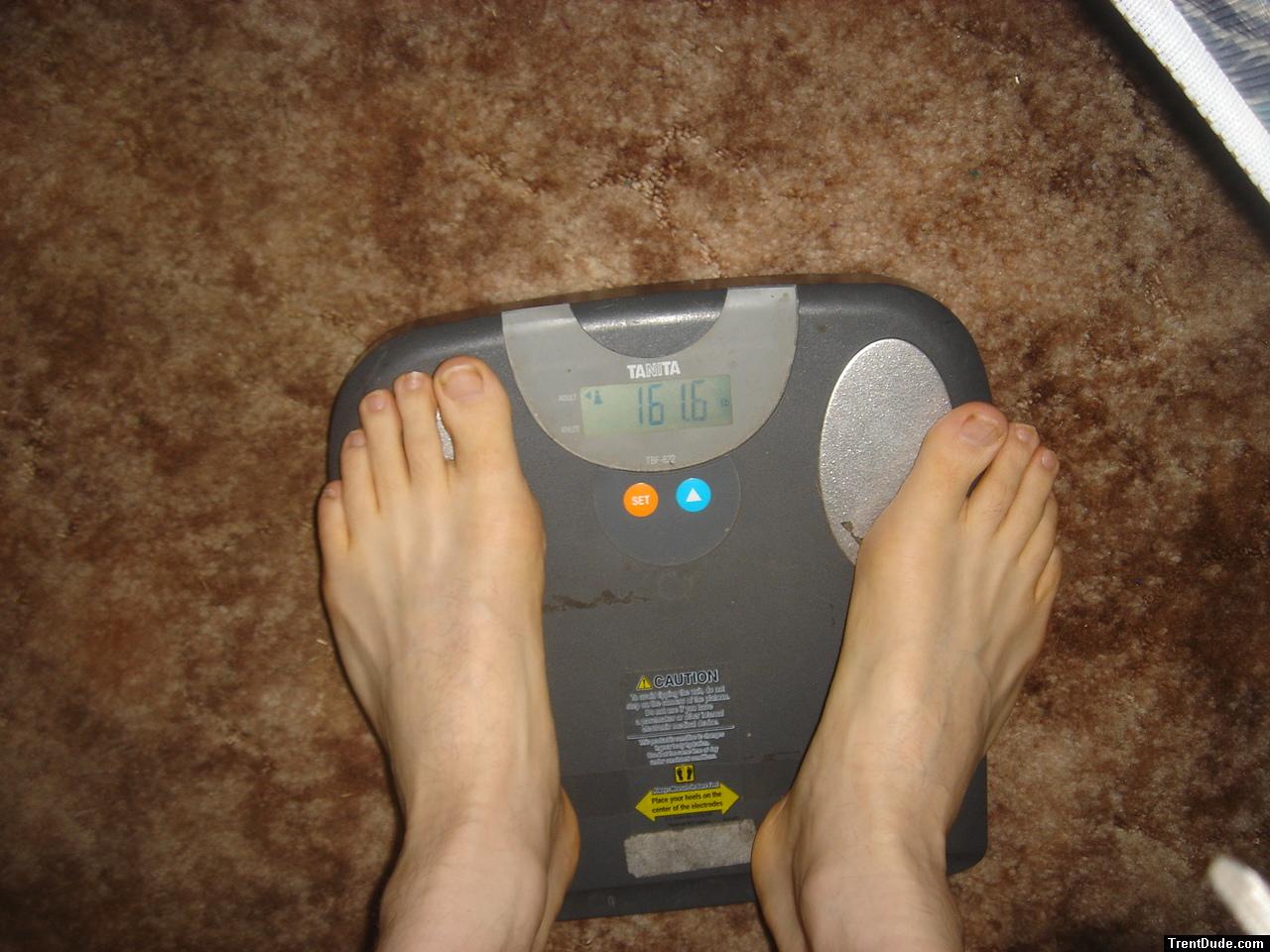 Trent's feet while weighing himself on a scale