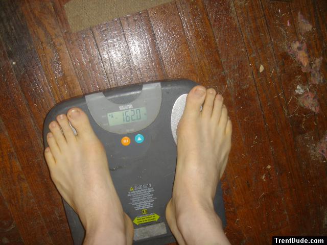 Trent's feet while weighing himself on a scale