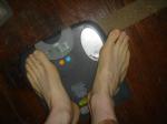 Trent's feet while weighing himself on a scale
