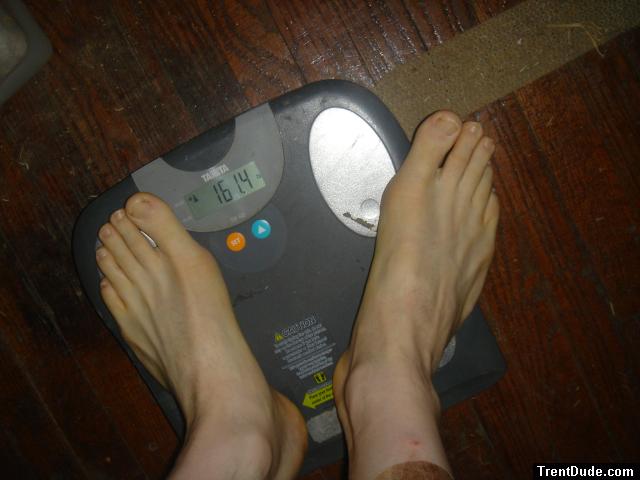 Trent's feet while weighing himself on a scale