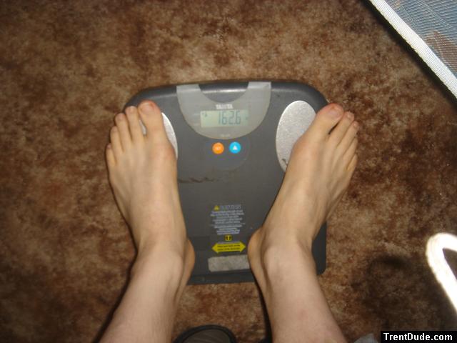 Trent's feet while weighing himself on a scale