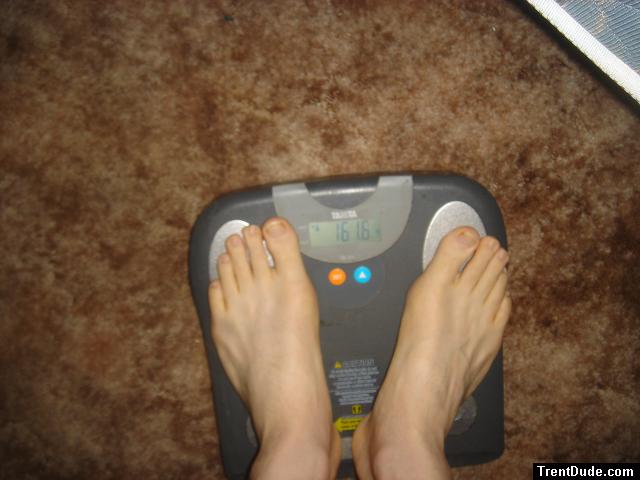Trent's feet while weighing himself on a scale