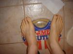 Trent's feet while weighing himself on a scale