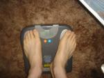 Trent's feet while weighing himself on a scale