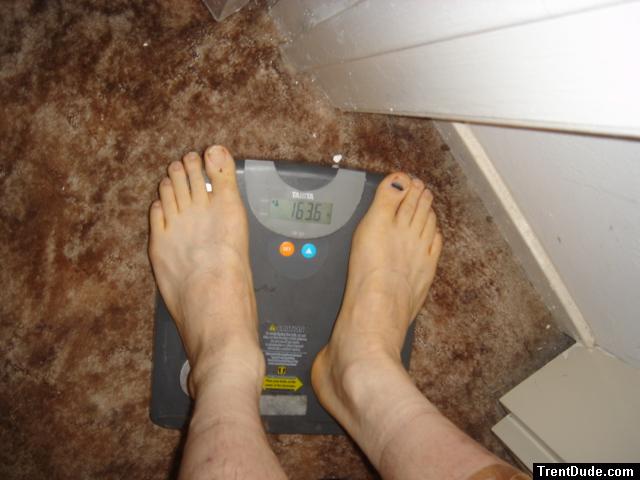 Trent's feet while weighing himself on a scale