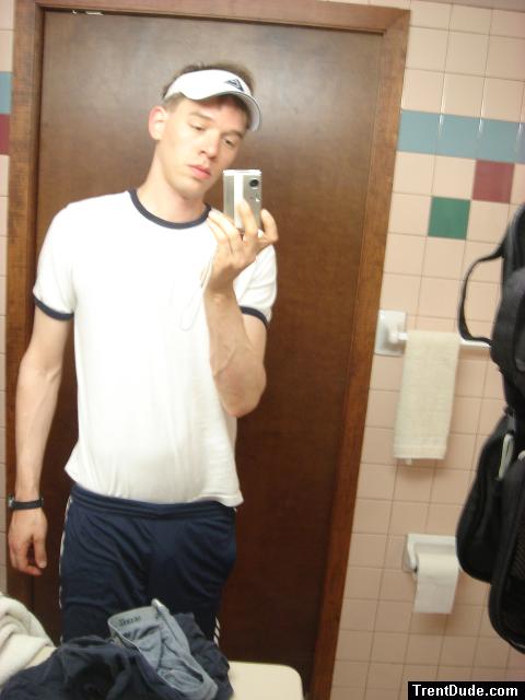 Blue addidas shorts in a motel bathroom