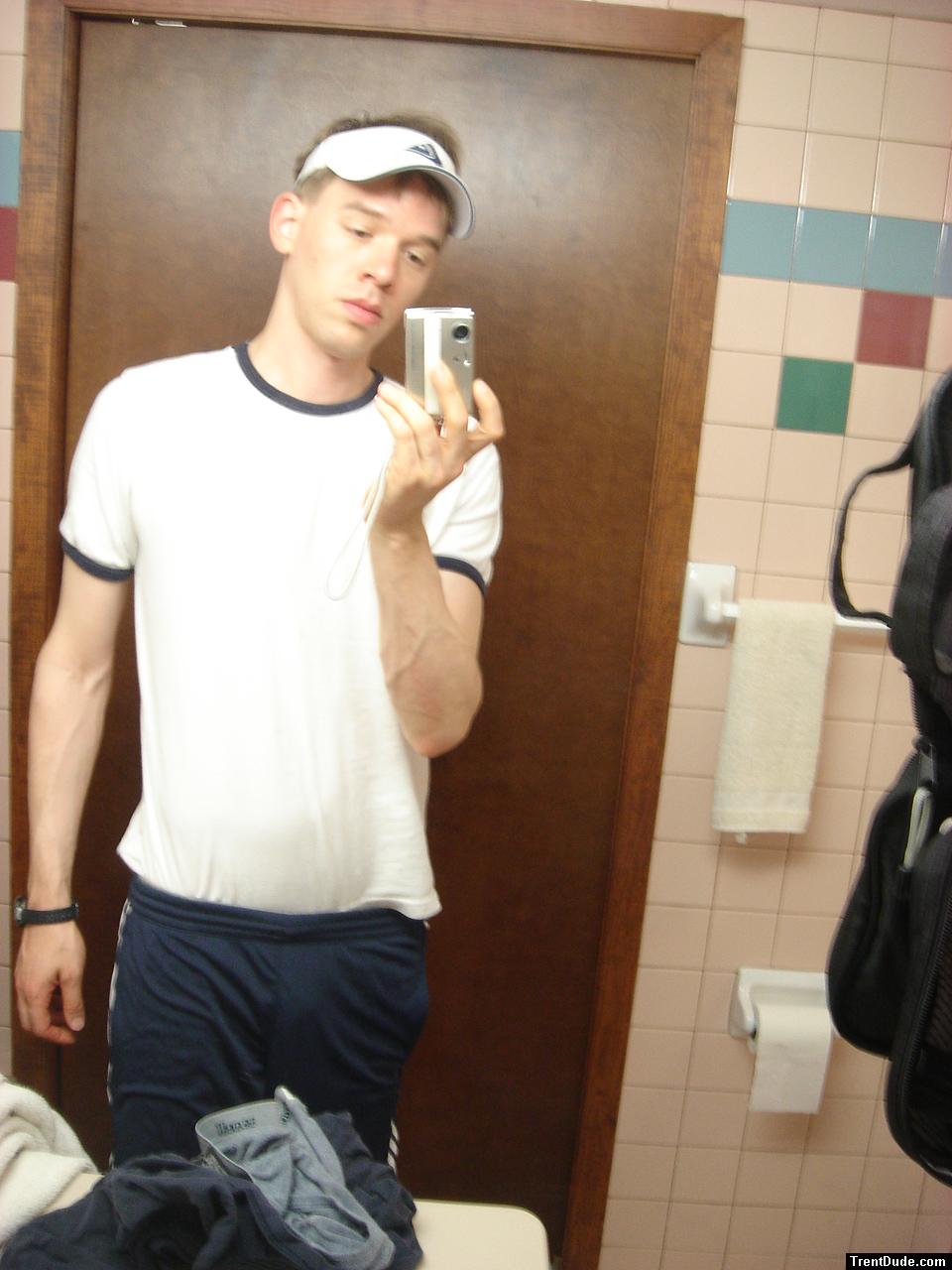 Blue addidas shorts in a motel bathroom