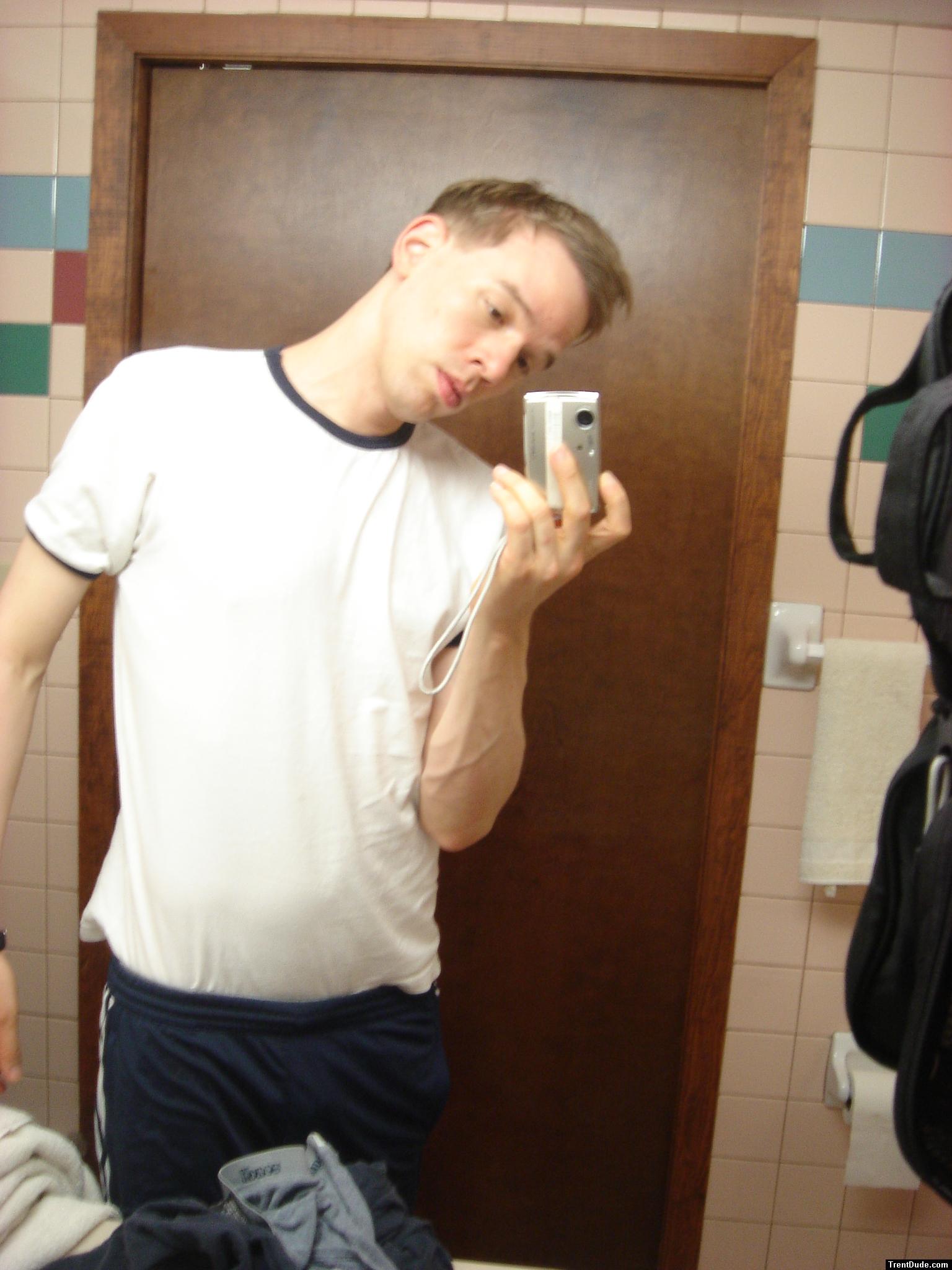 Blue addidas shorts in a motel bathroom