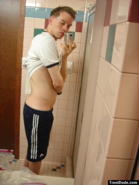 Blue addidas shorts in a motel bathroom