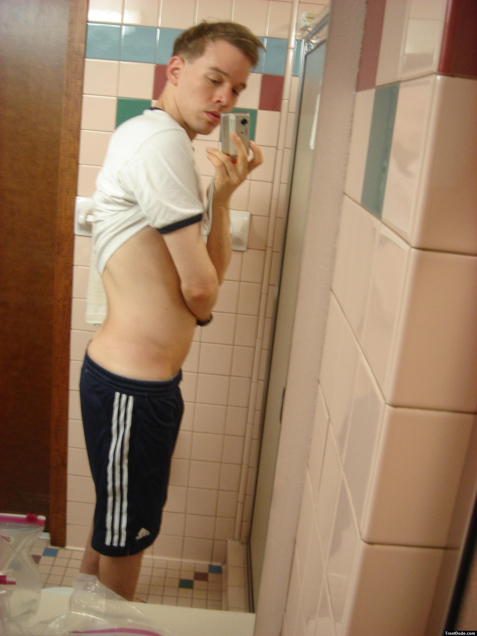 Blue addidas shorts in a motel bathroom