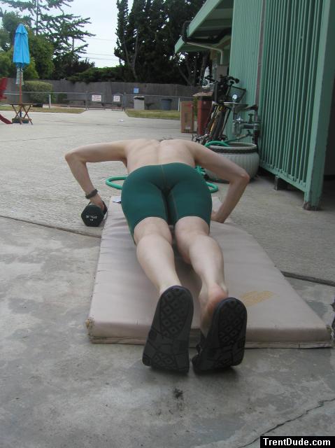 push-ups in a Nike green swim jammer
