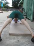 push-ups in a Nike green swim jammer