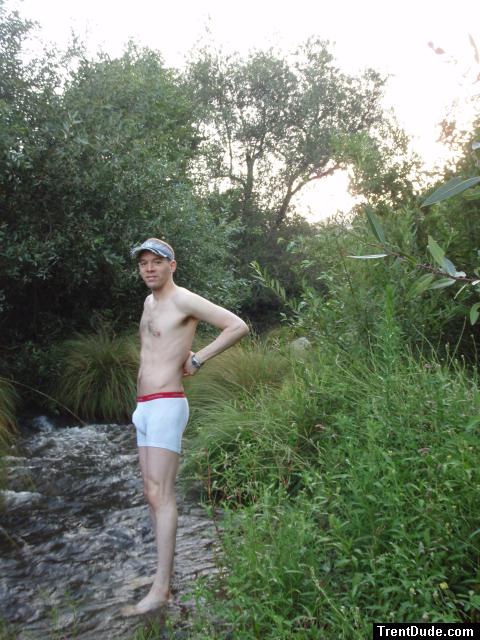 Wearing Calvin Klein boxer briefs in a stream