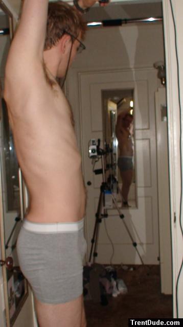Wearing glasses, grey boxer briefs