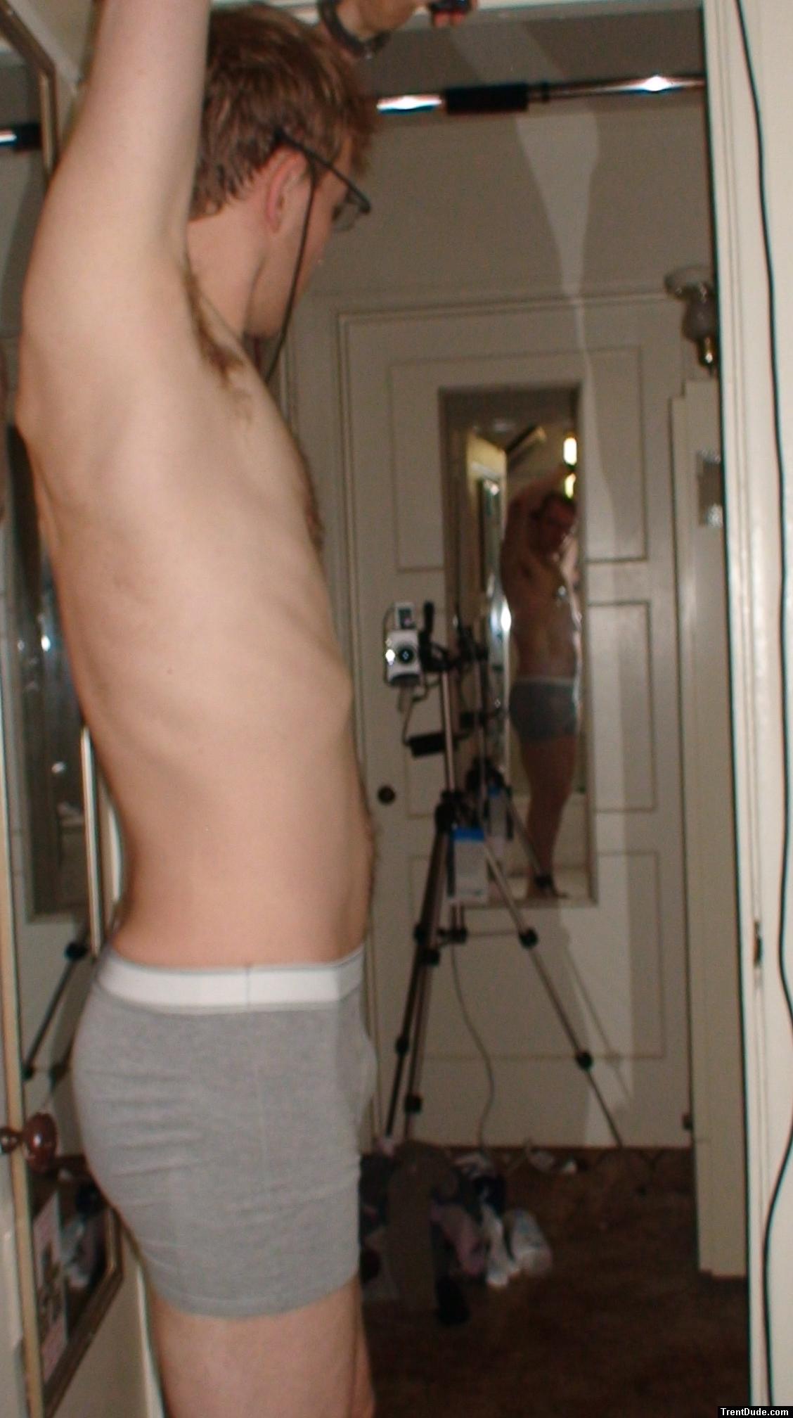Wearing glasses, grey boxer briefs