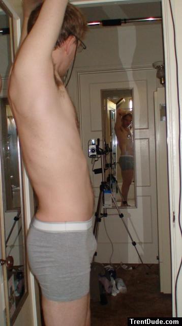 Wearing glasses, grey boxer briefs
