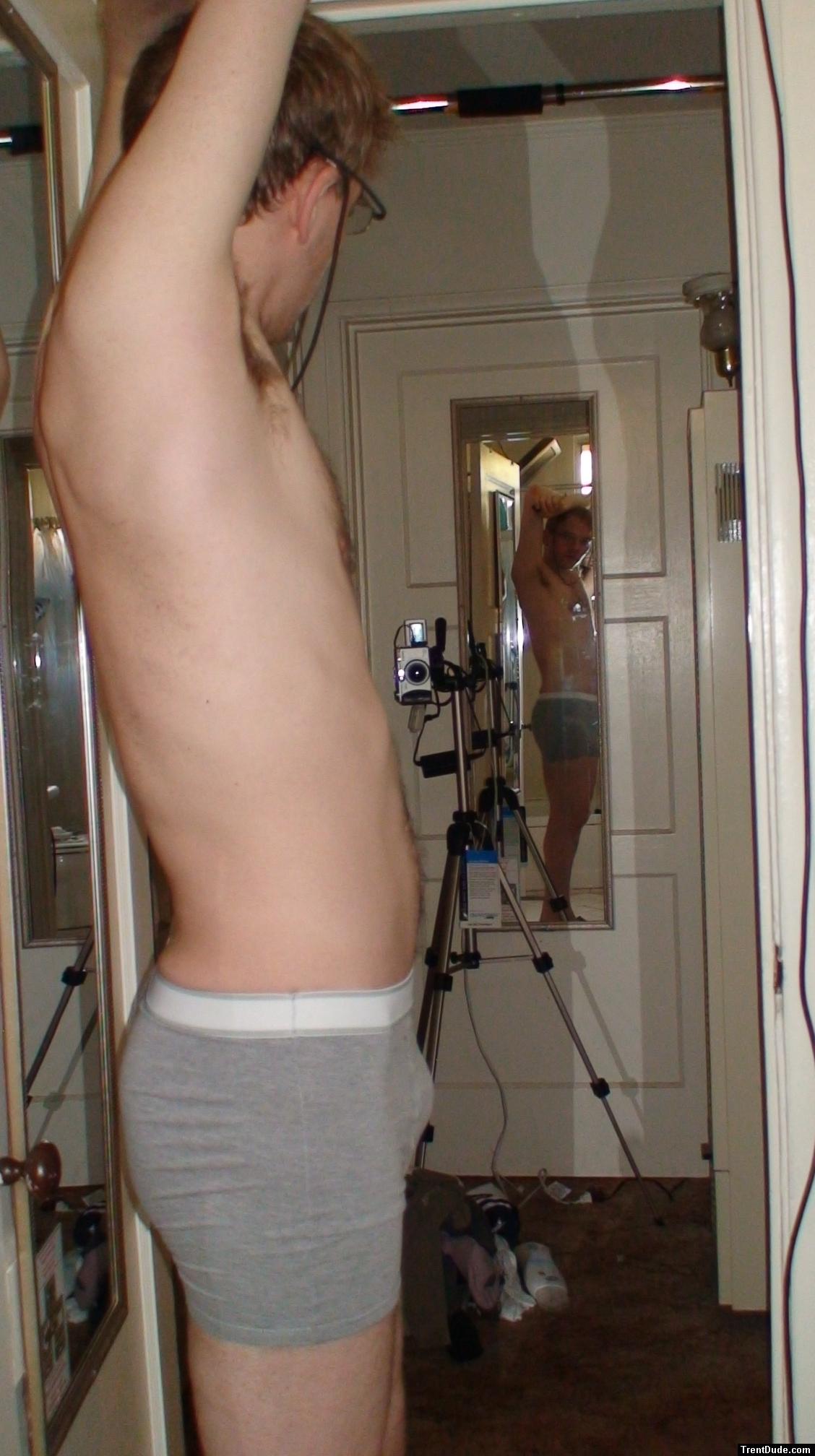 Wearing glasses, grey boxer briefs