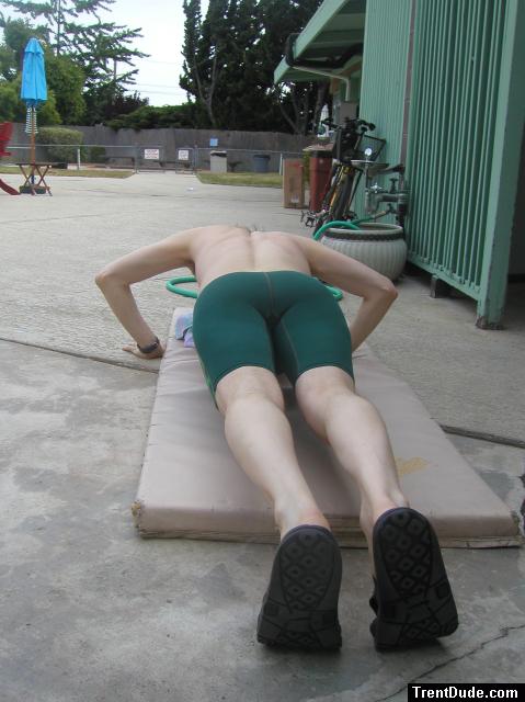 push-ups in a Nike green swim jammer