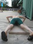 thigh muscles in a green nike swim jammer
