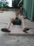 Crunches in a Nike swim jammer, toes in Nike slippers
