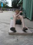Crunches in a Nike swim jammer, toes in Nike slippers