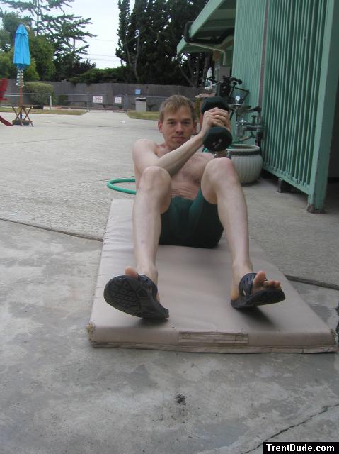 Crunches in a Nike swim jammer, toes in Nike slippers