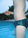 Green Nike speedo brief in the pool (closeup)
