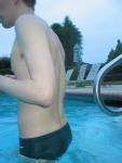 Green Nike speedo brief in the pool (back)