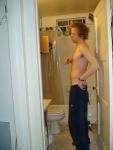 Shirtless in Addias sweat pants (rear)