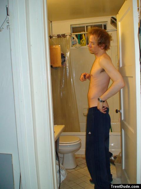 Shirtless in Addias sweat pants (rear)