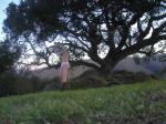 Undressing by a tree