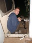 sitting with raccoons at the door!