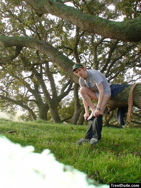 Getting dressed into Nike compression shorts under a tree